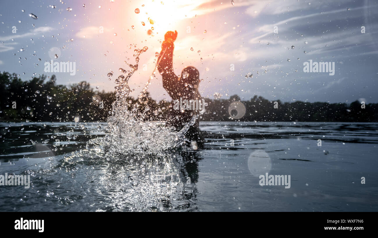 water battle at the sunset lake Stock Photo