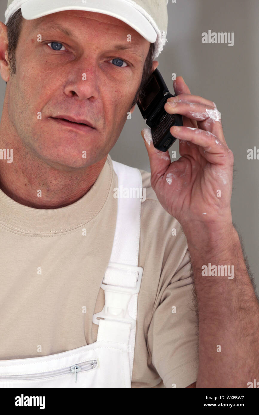 Painter making telephone call Stock Photo