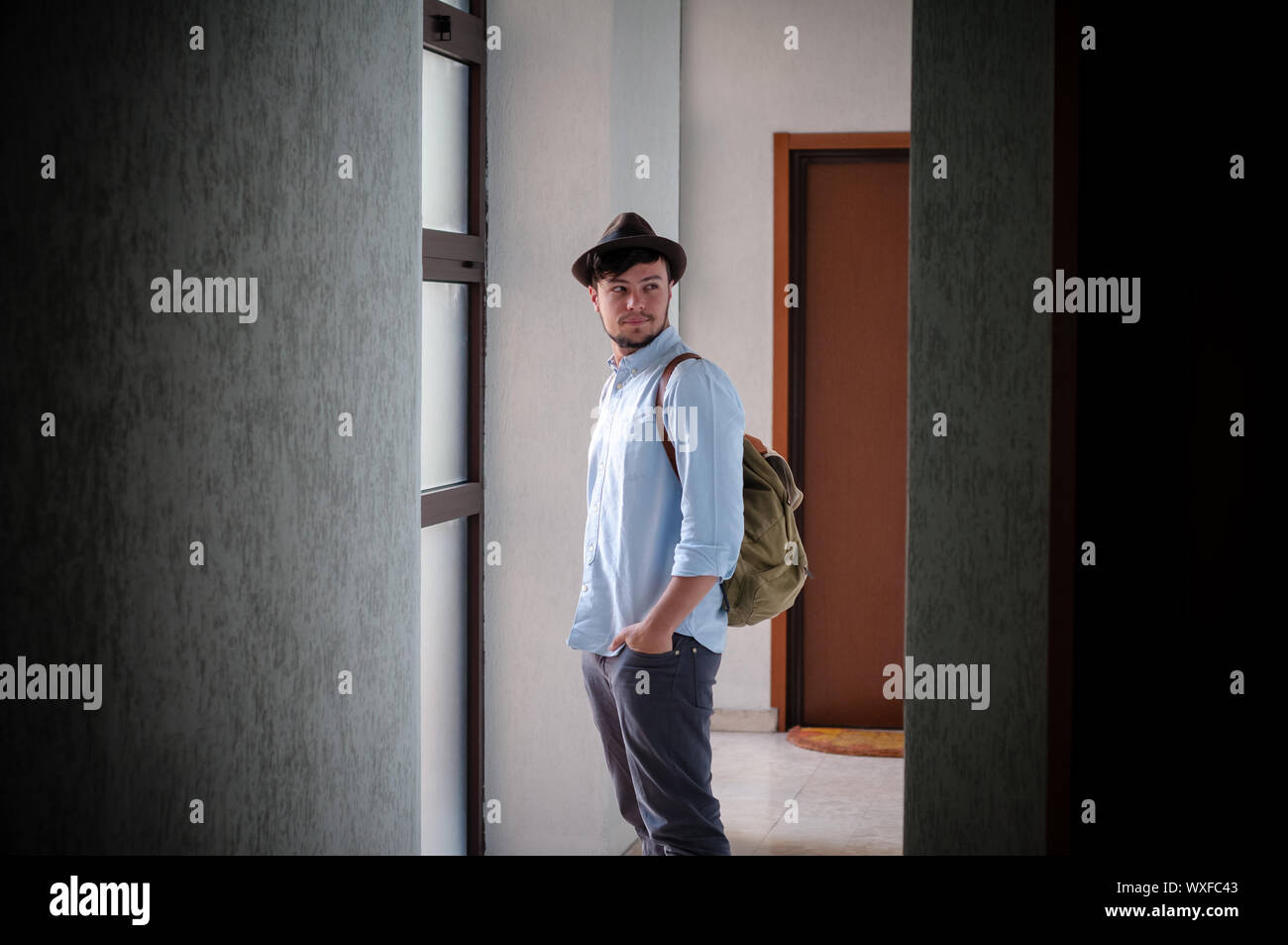 hipster young man posing in a hallway Stock Photo - Alamy