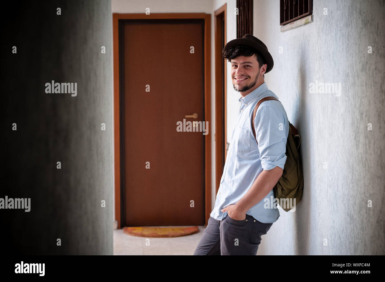 hipster young man posing in a hallway Stock Photo - Alamy