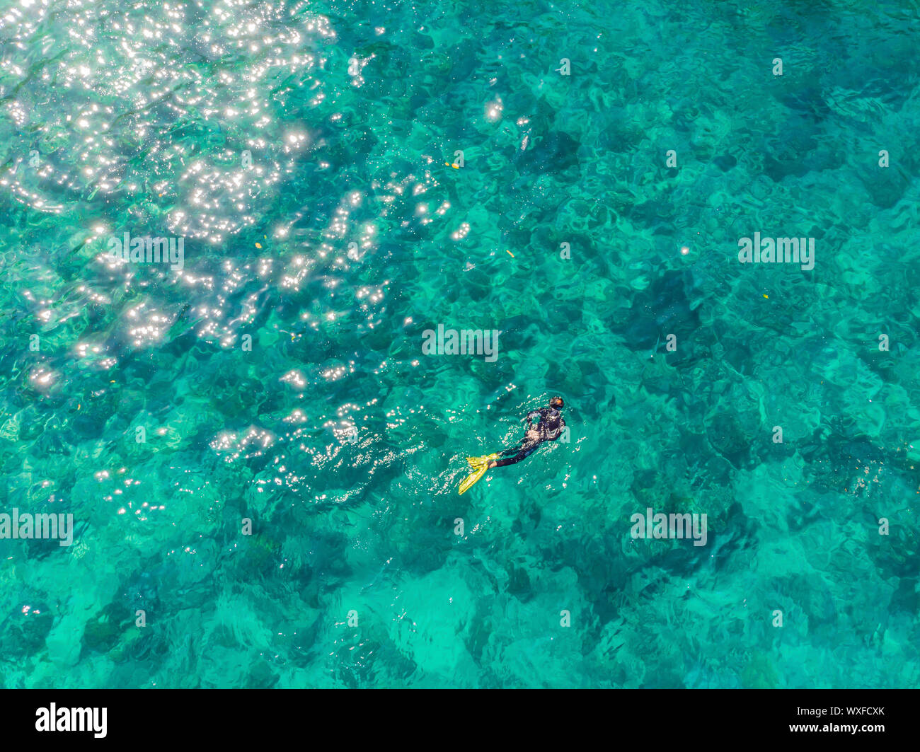 Aerial view couple snorkeling in hi-res stock photography and images ...