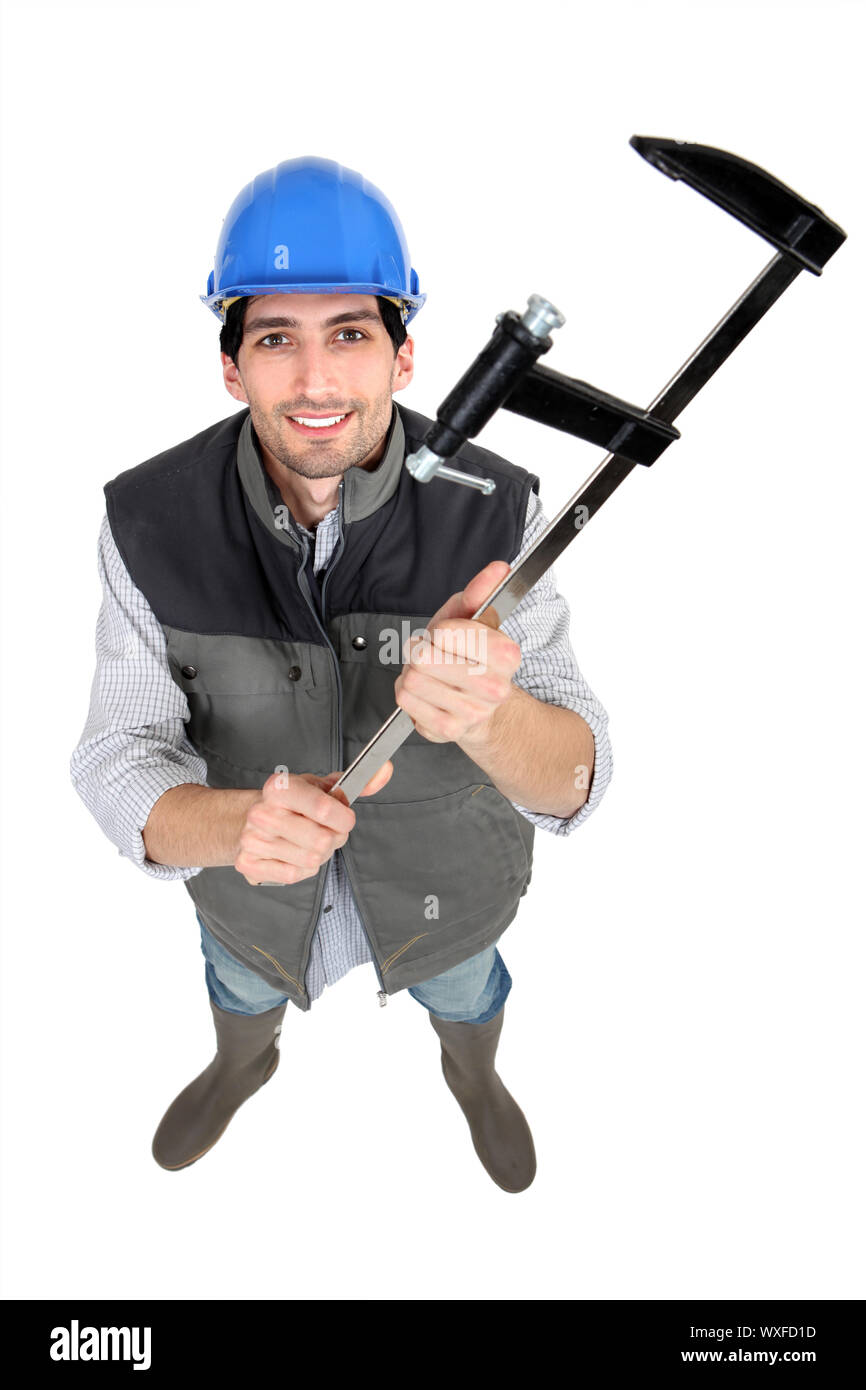 Builder holding clamp Stock Photo Alamy