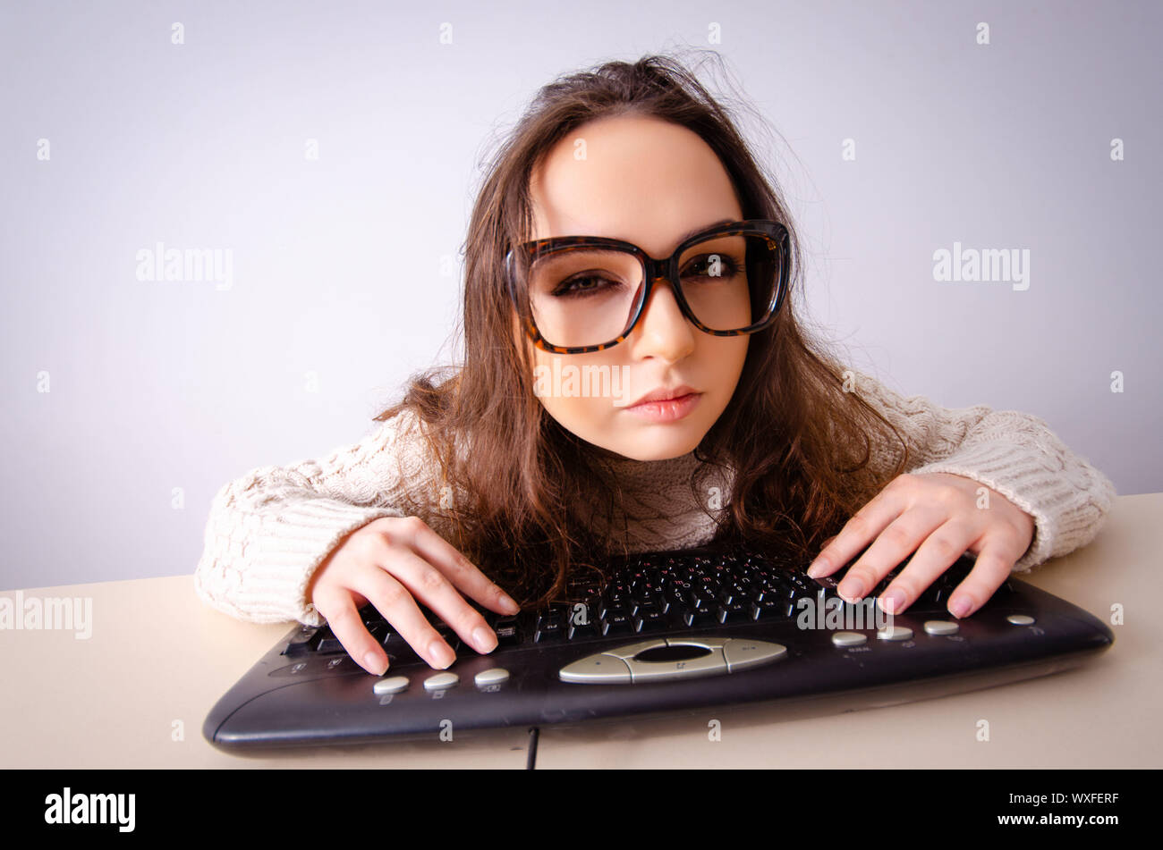 Funny nerd girl working on computer Stock Photo - Alamy