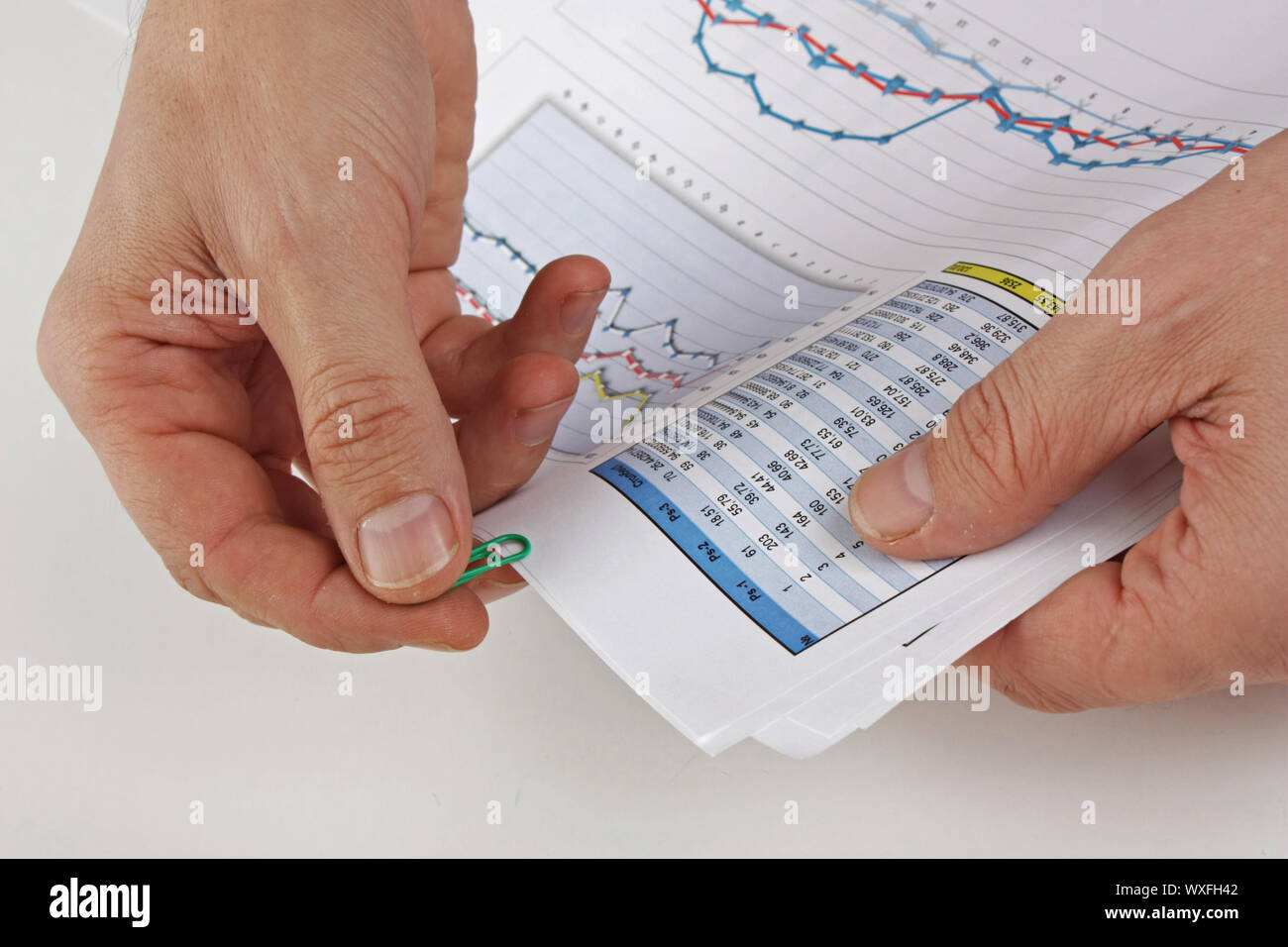Graphs tables and documents laid on the table Stock Photo