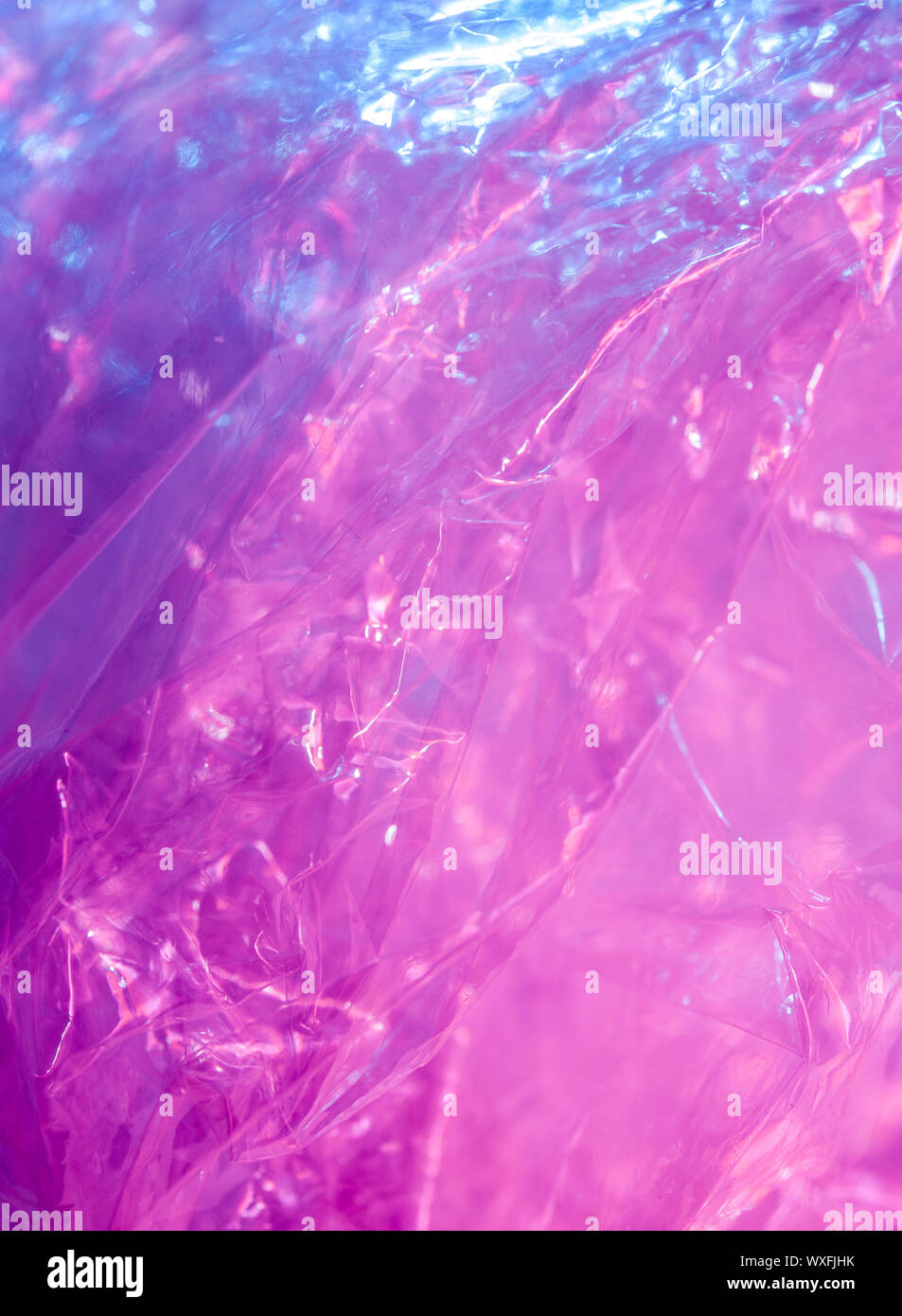 Holographic Background In The Style Of The 80 90s Real Texture Of Cellophane Film In Bright Acid Colors Stock Photo Alamy