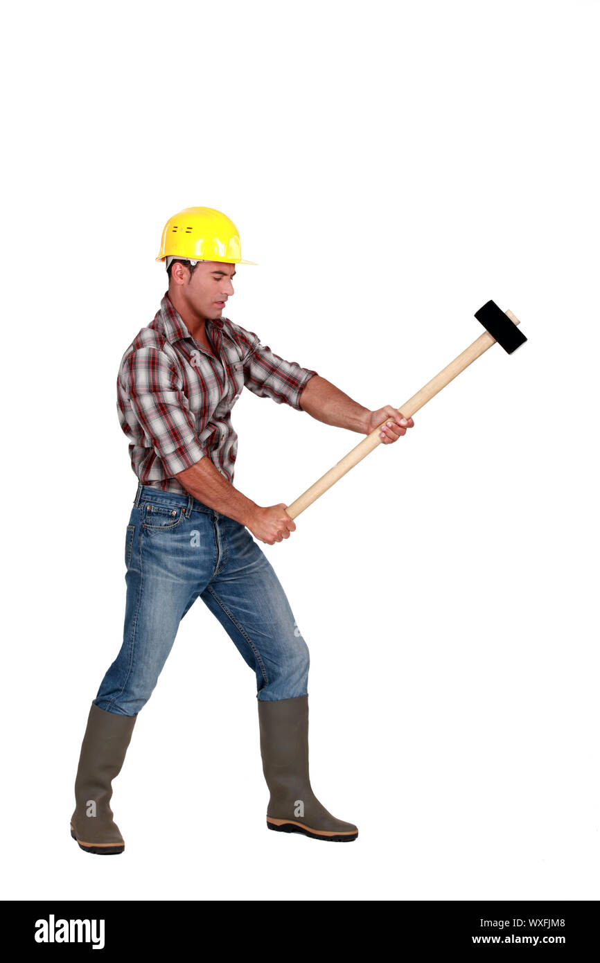 Man using sledgehammer Stock Photo Alamy