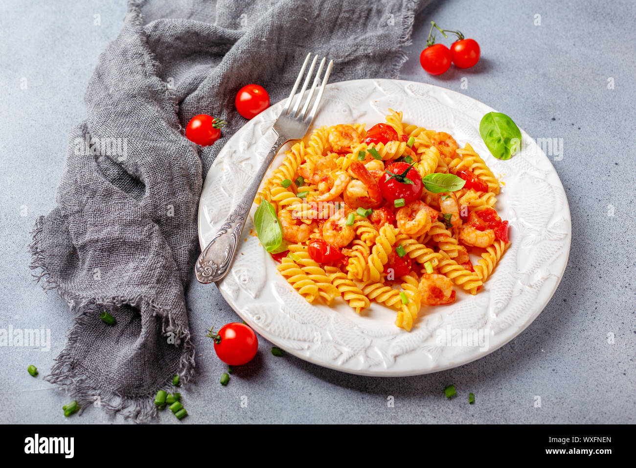 Pasta with shrimp in tomato sauce. Stock Photo