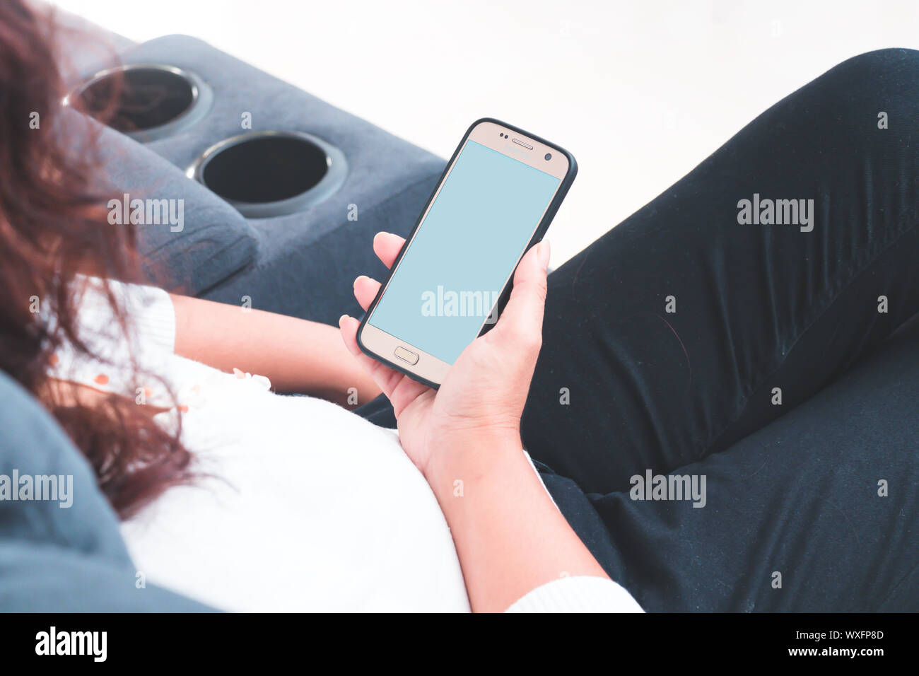 Back view close up of a woman hand using a smart phone Stock Photo - Alamy