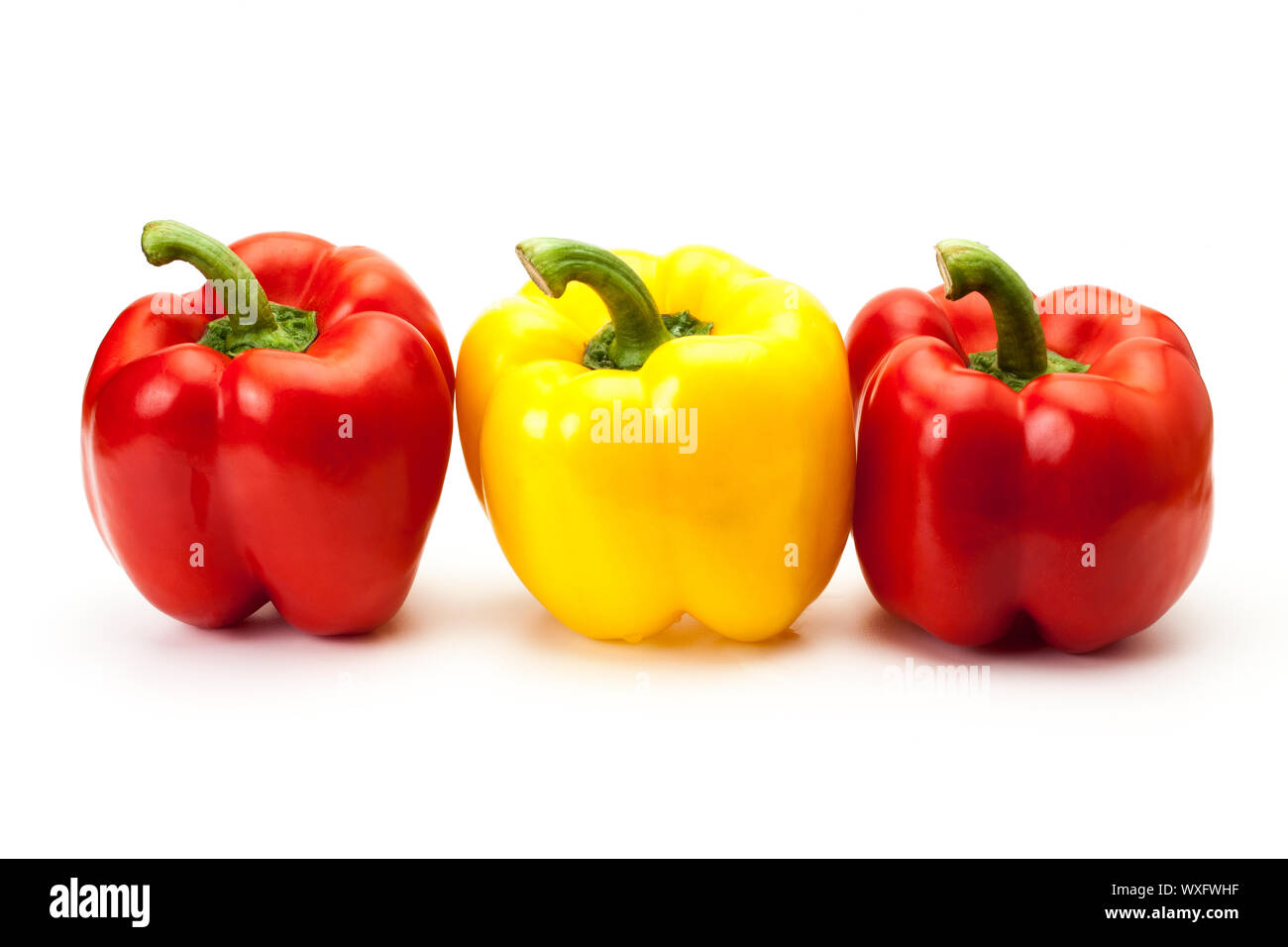 colorful bell peppers isolated on white background Stock Photo - Alamy