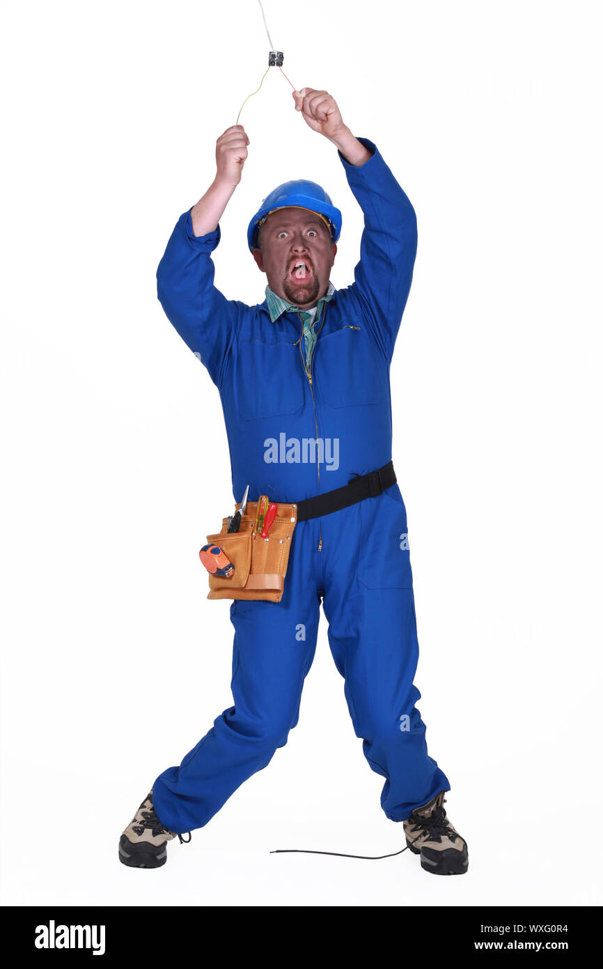 Electrician receiving an electric shock Stock Photo Alamy