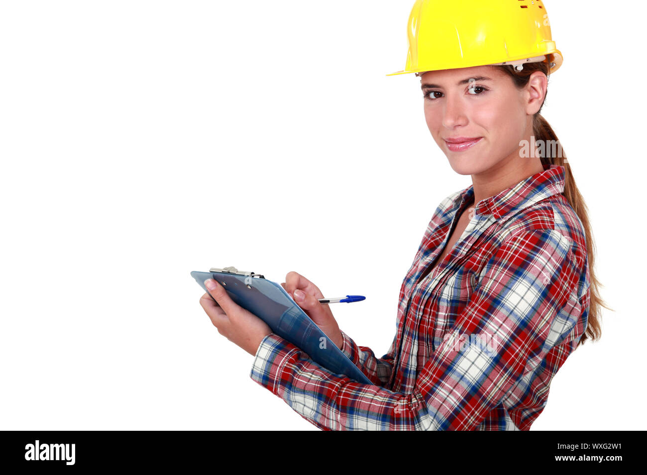 craftswoman taking notes Stock Photo