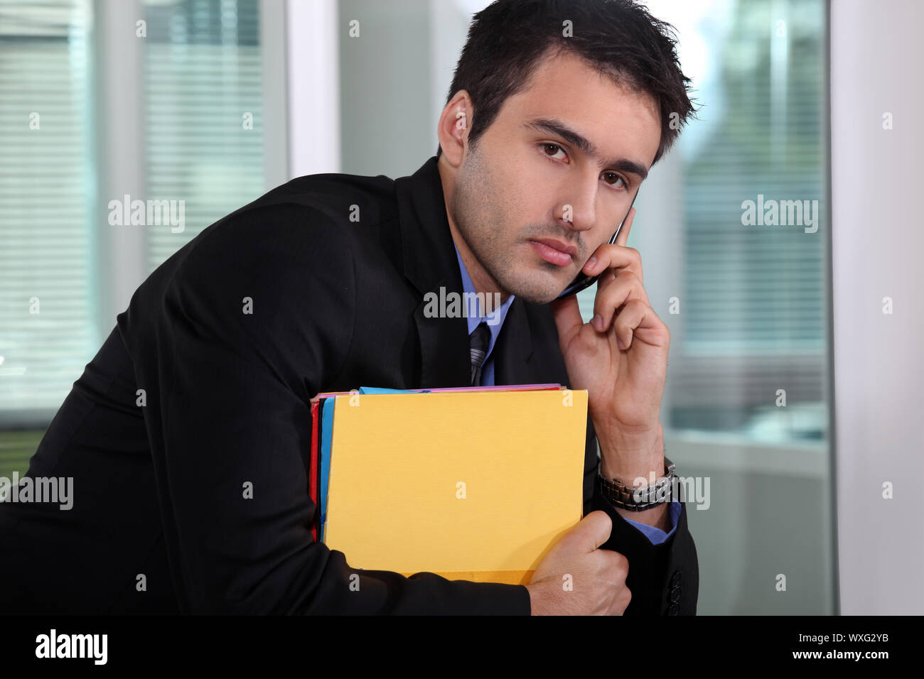 Businessman talking on his mobile phone Stock Photo
