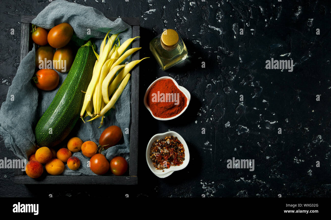 Vegetables on a dark background. Spices Stock Photo