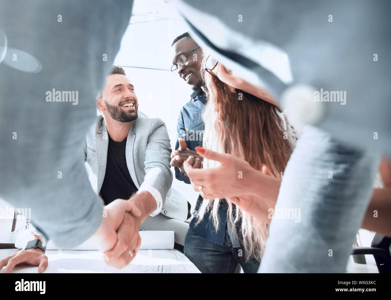close up.architect and customer shaking hands Stock Photo