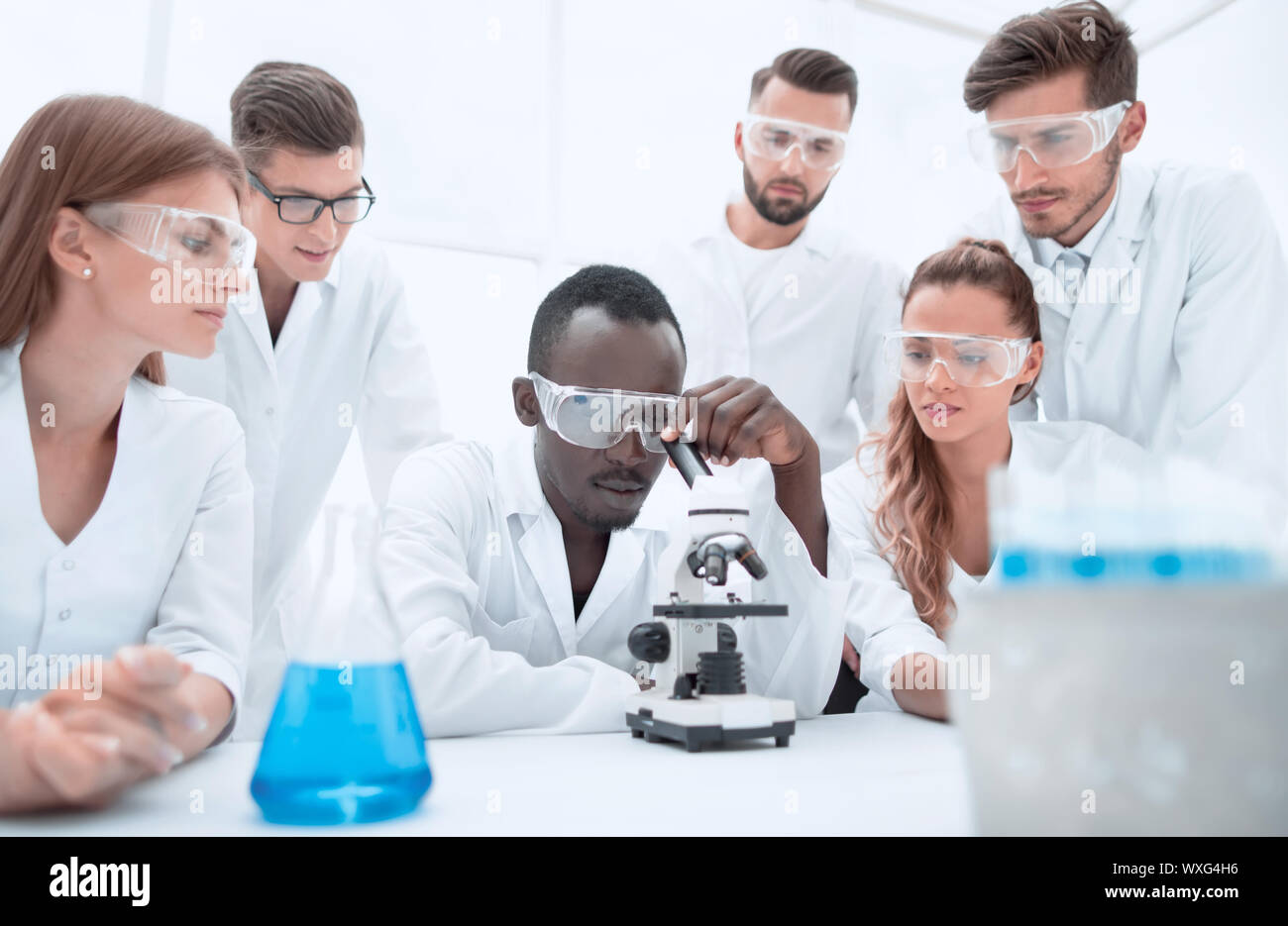 Group of young scientists working in the chemical laboratory Stock ...