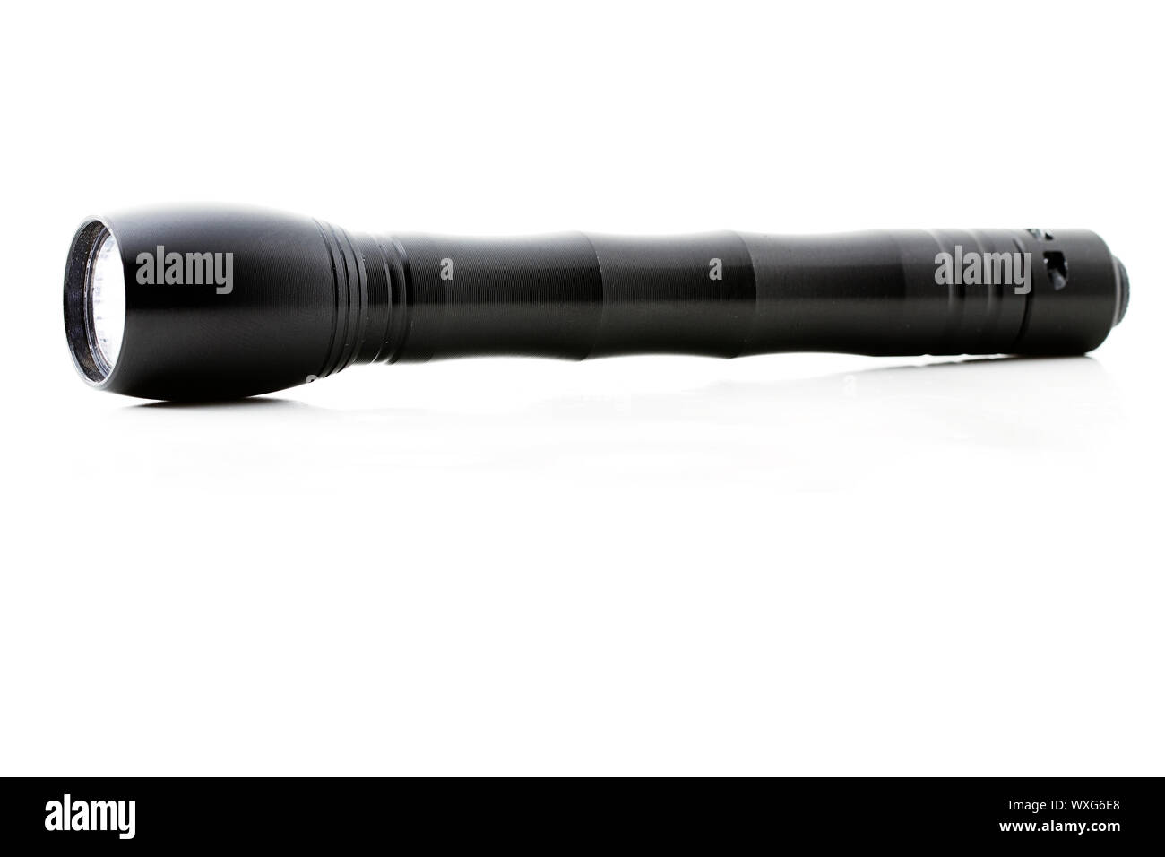 one flashlight from the side on white background Stock Photo - Alamy