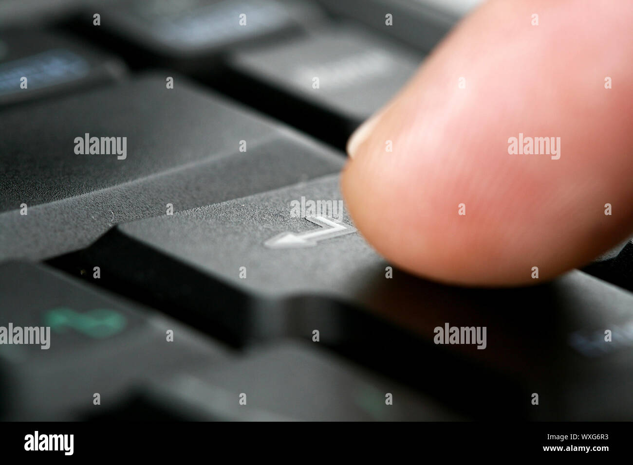 finger press notebook button concept Stock Photo - Alamy