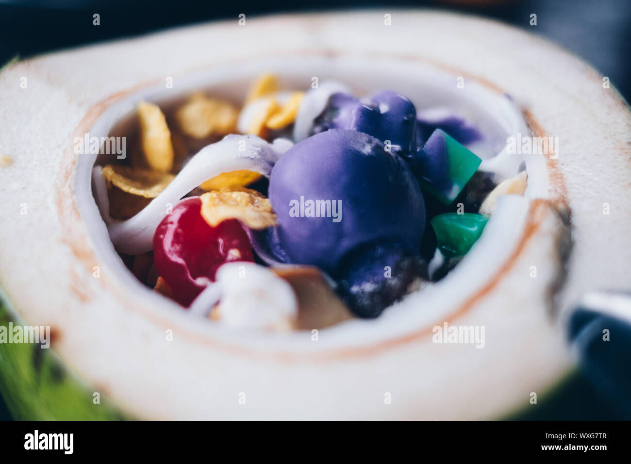 Close up of the popular and favorite Filipino cold dessert 'Buko' or Coconut Halo-halo (also spelled haluhalo). Selective focus. Stock Photo