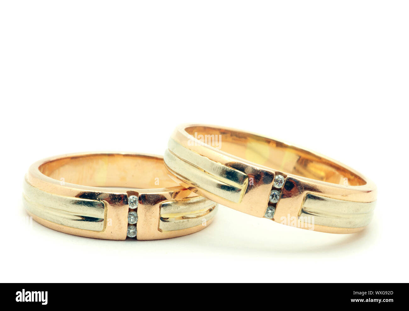 Gold wedding rings isolated on white background Stock Photo - Alamy