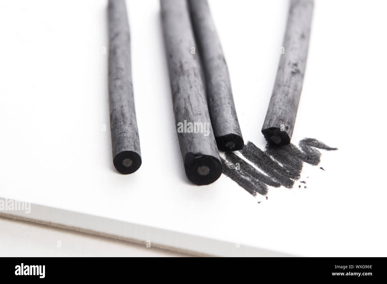 Artist's black charcoal with smudge Stock Photo - Alamy