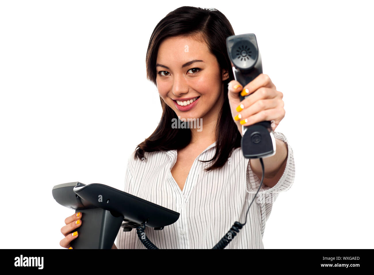 Personal assistant showing the telephone receiver Stock Photo Alamy