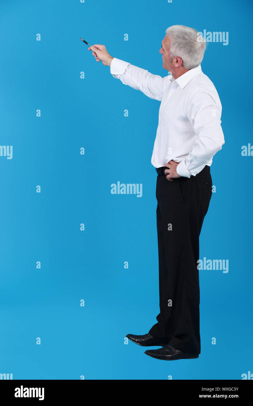 Man pointing to an invisible object Stock Photo