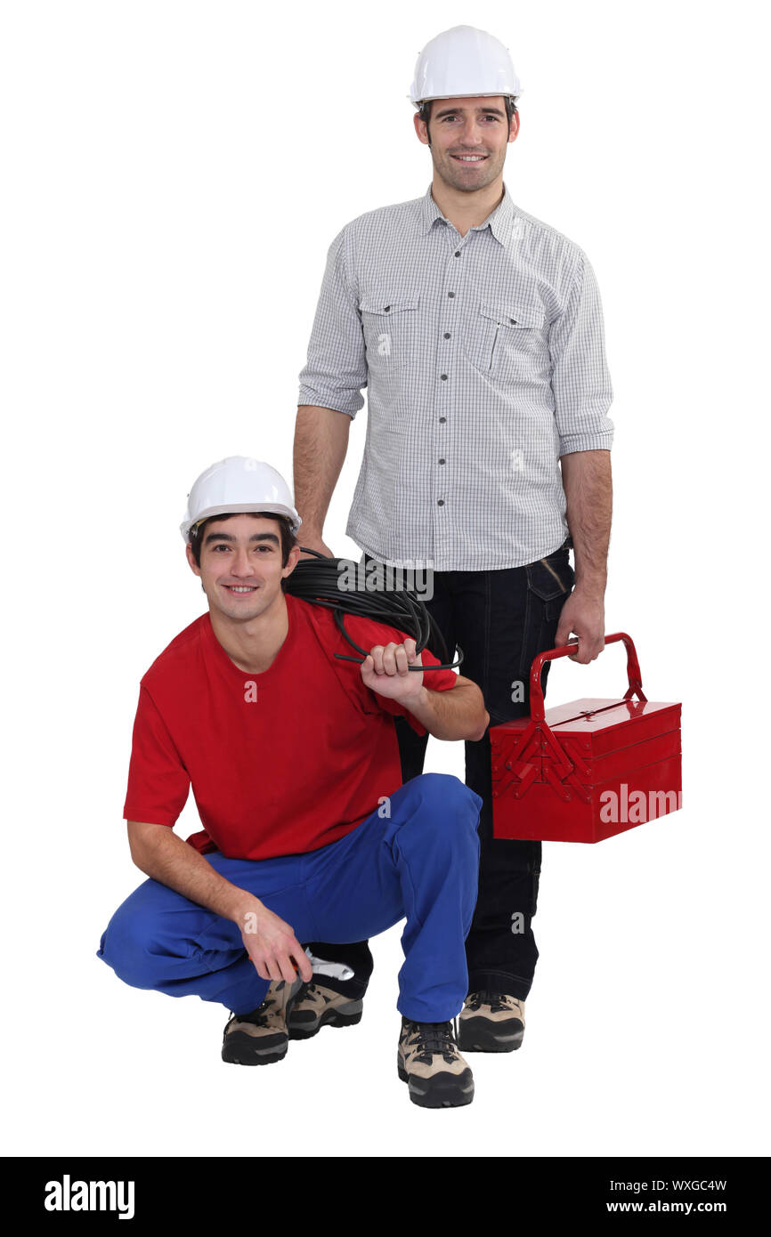 Two electricians working together Stock Photo