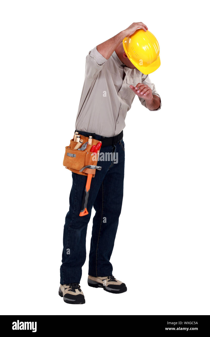 Tradesman suffering from a work injury Stock Photo