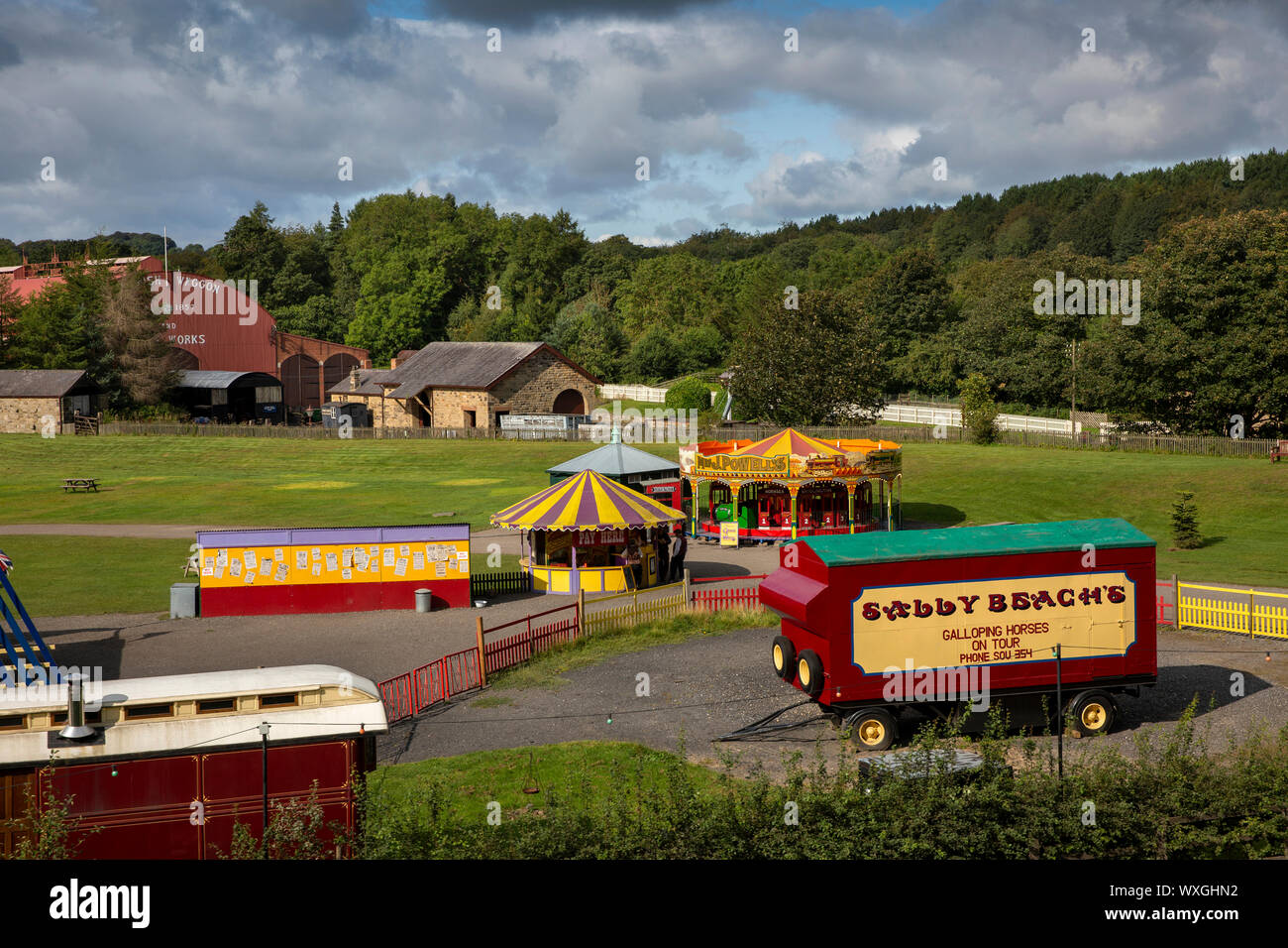 UK, County Durham, Beamish, Museum, Town, fairground in field beside Waggon and Iron Works shed Stock Photo