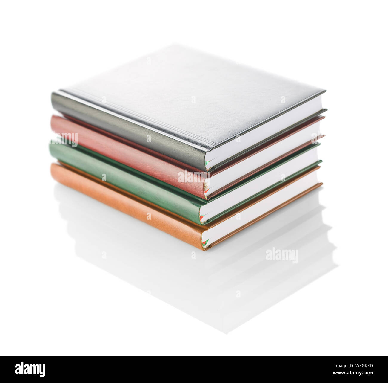 stack of four diaries isolated Stock Photo