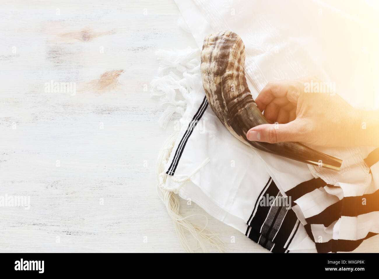 religion image of shofar (horn) on white prayer talit. Rosh hashanah