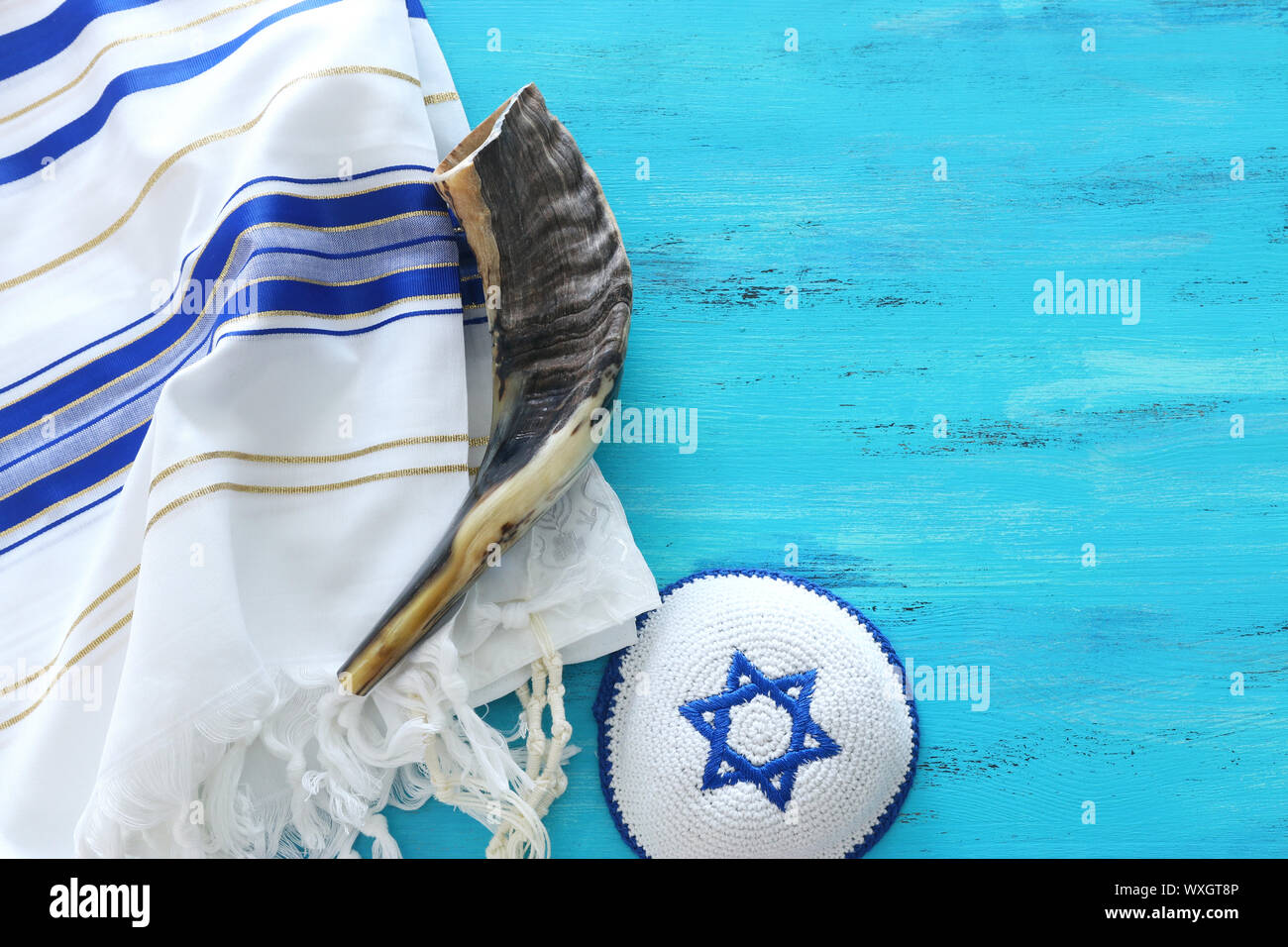 religion image of shofar (horn) on white prayer talit. Rosh hashanah