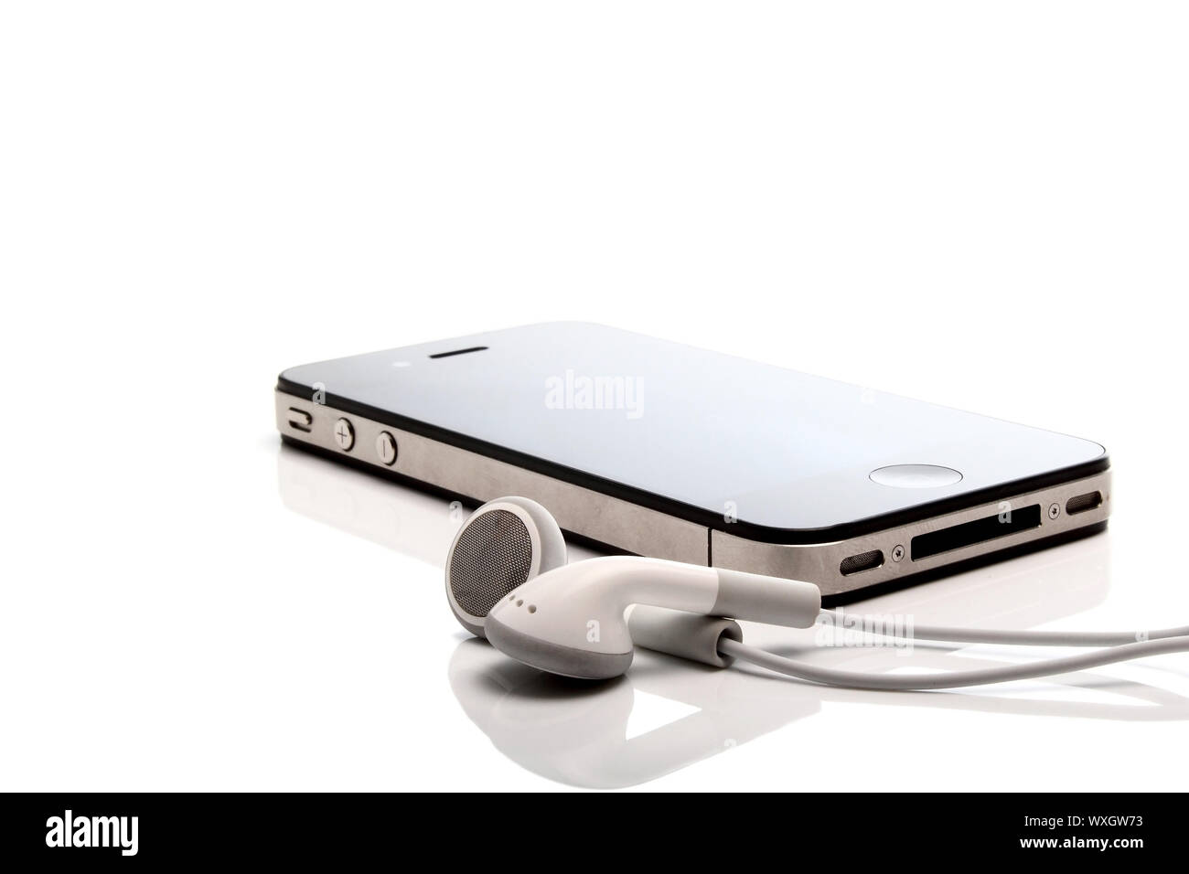 Iphone 4S and earphones Stock Photo