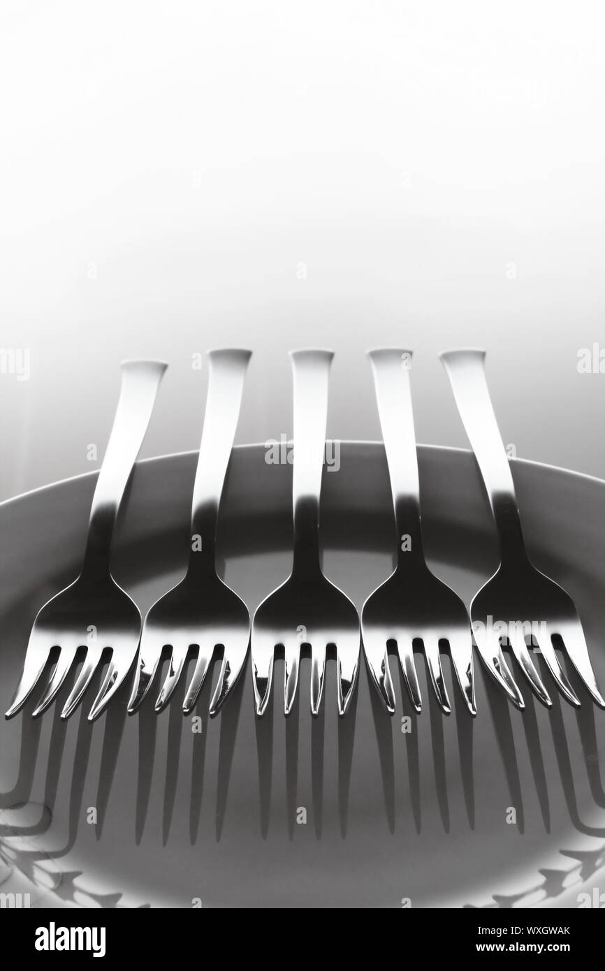 Five forks and a dish Stock Photo Alamy