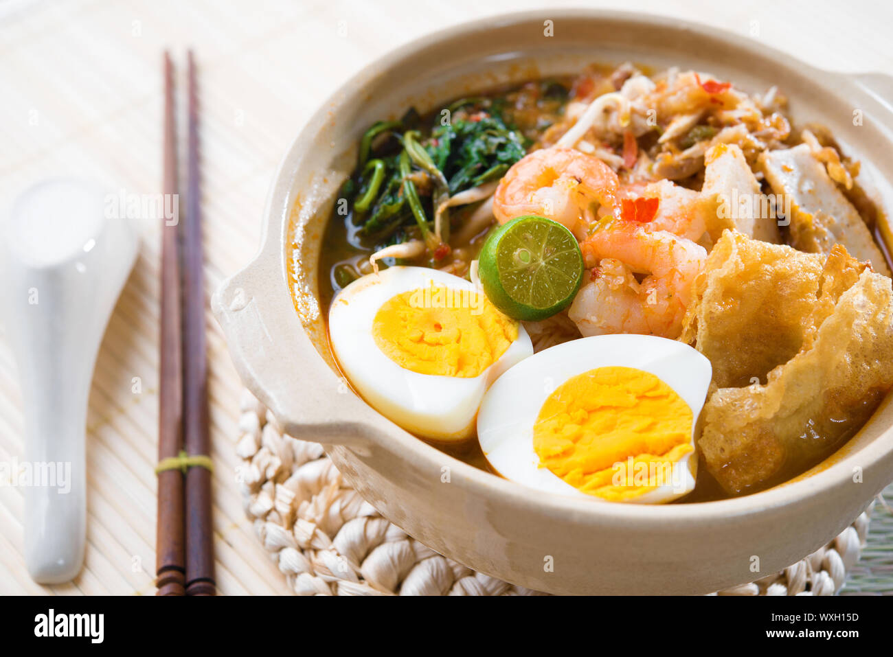 Singapore prawn mee or prawn noodles. Famous Singaporean food spicy