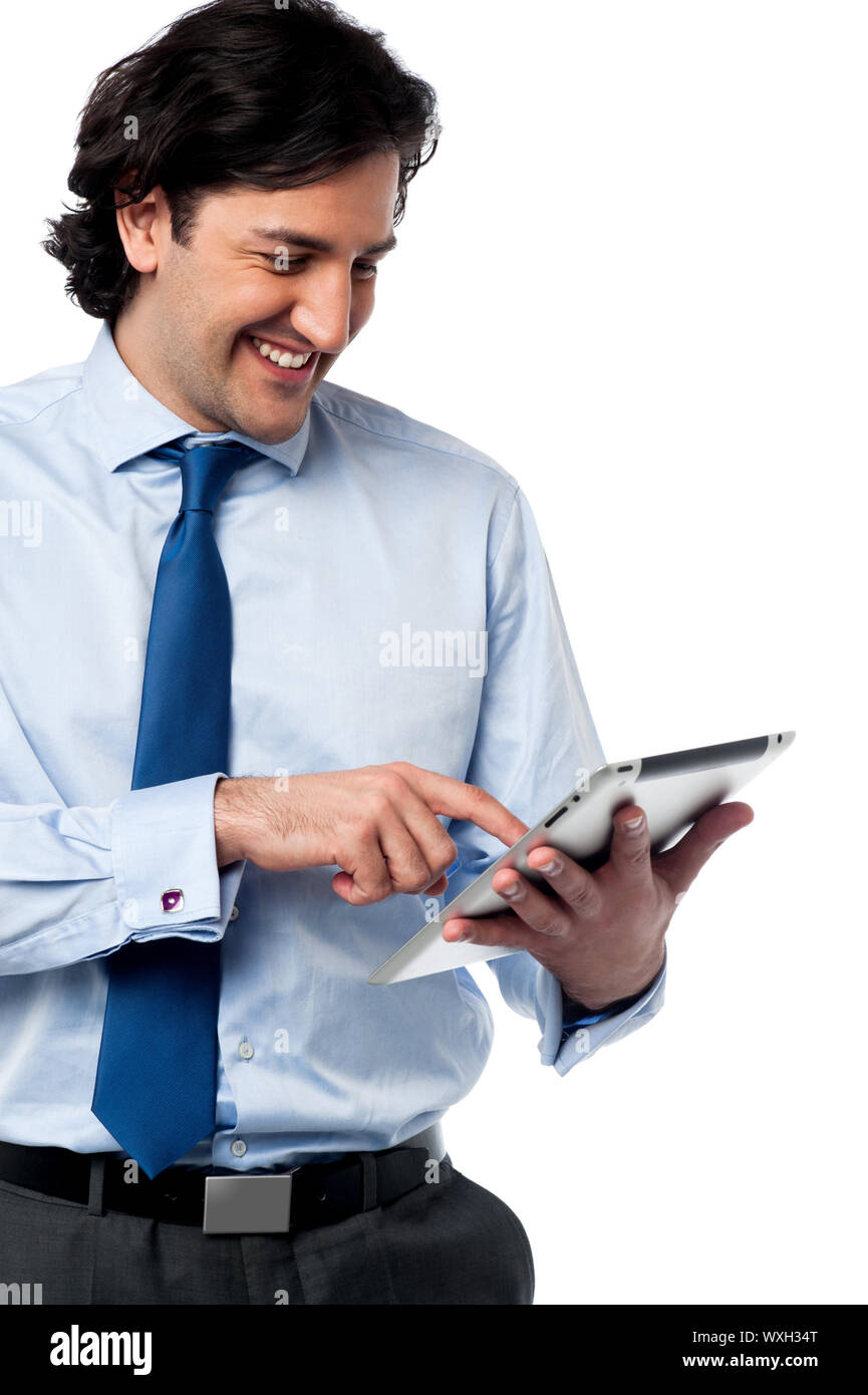 Young businessman operating tablet device Stock Photo