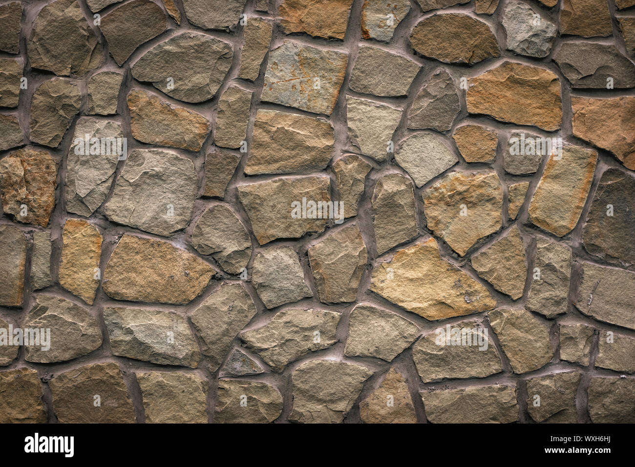 Brown stone texture, retro style. Brick wall background. Abstract rocks pattern. Gray stones, textured surface. Natural backdrop. Marble facade buildi Stock Photo