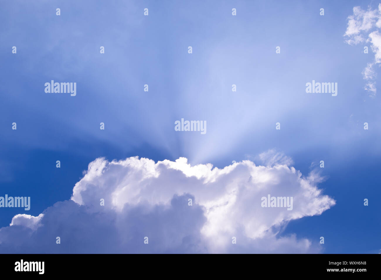 Beautiful Blue Sky with Sun Rays. Bright Beams through Clouds Stock ...