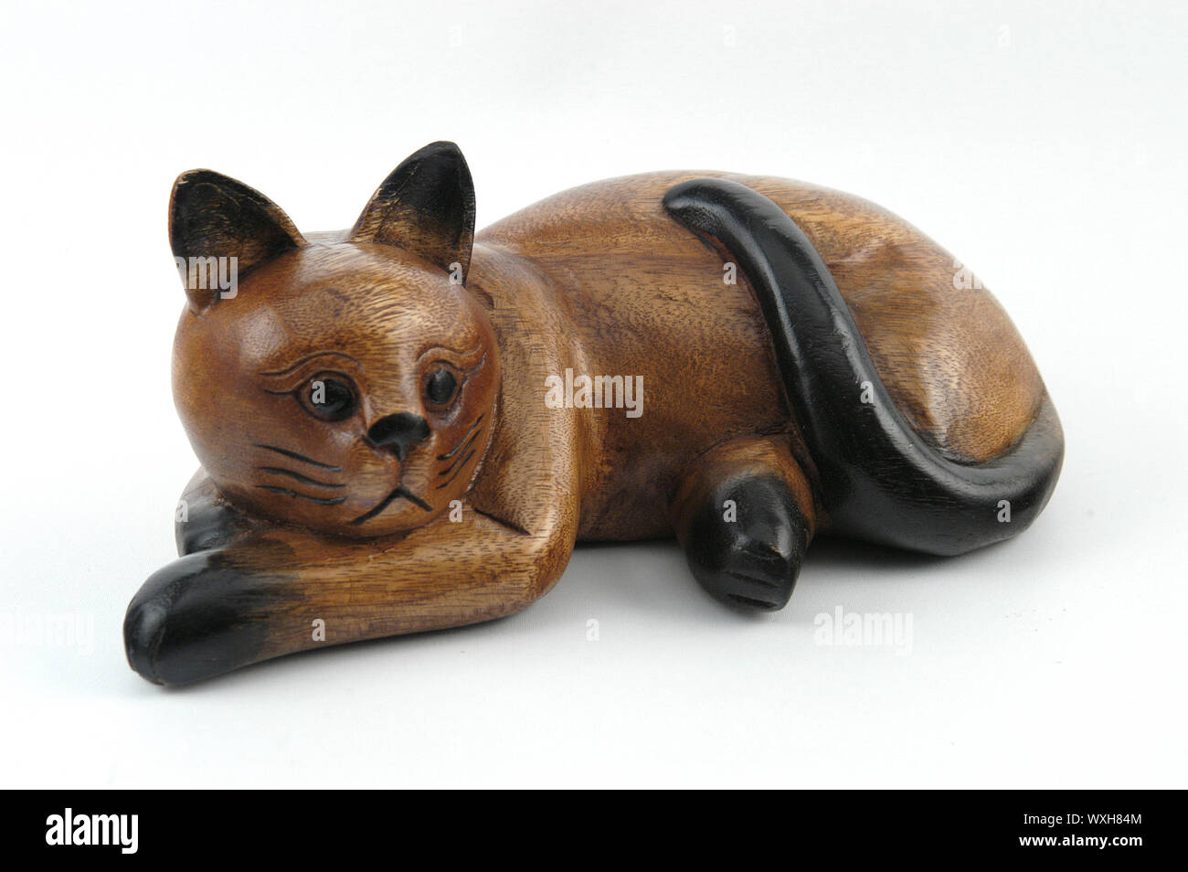 Brown wooden cat isolated on white background Stock Photo - Alamy