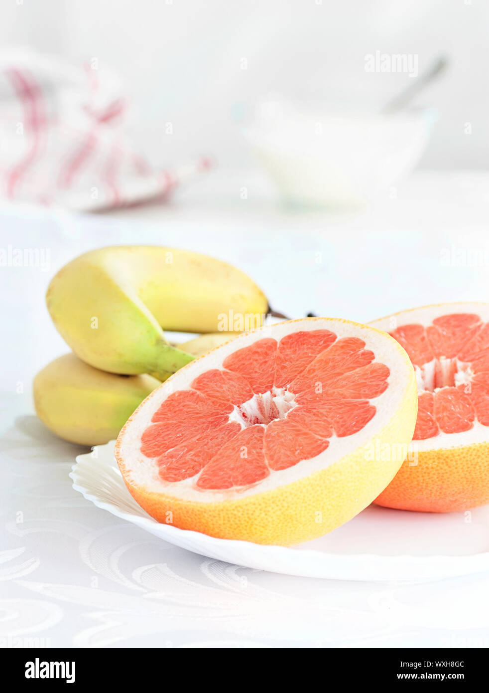 Fresh fruit. Grapefruit and banana breakfast Stock Photo Alamy