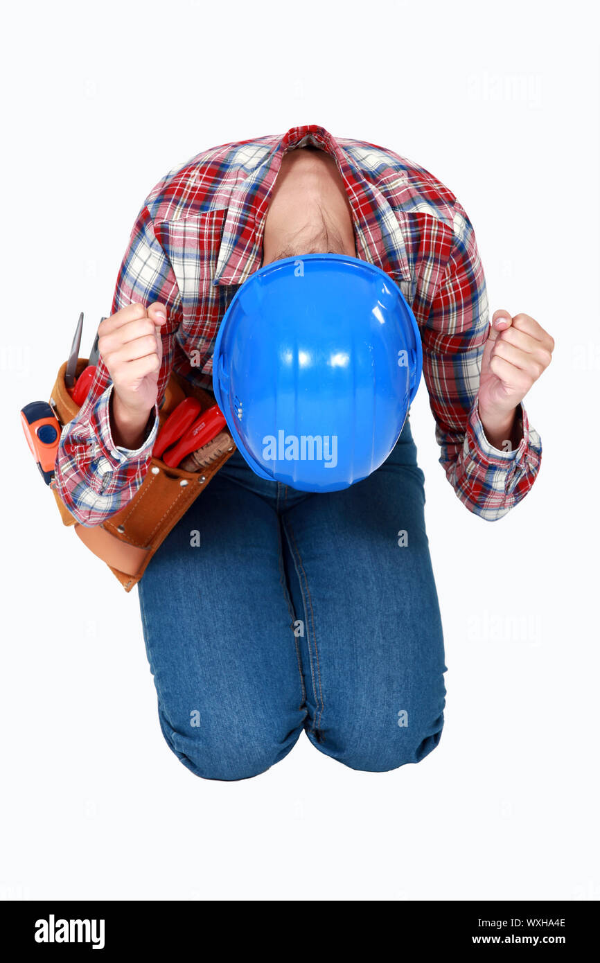 Mason knees hitting the floor with his fists Stock Photo Alamy
