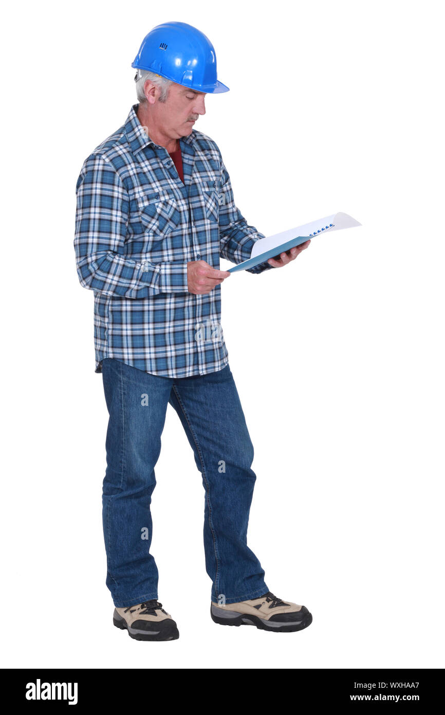Filing Foreman Experienced foreman with plans Stock Photo - Alamy