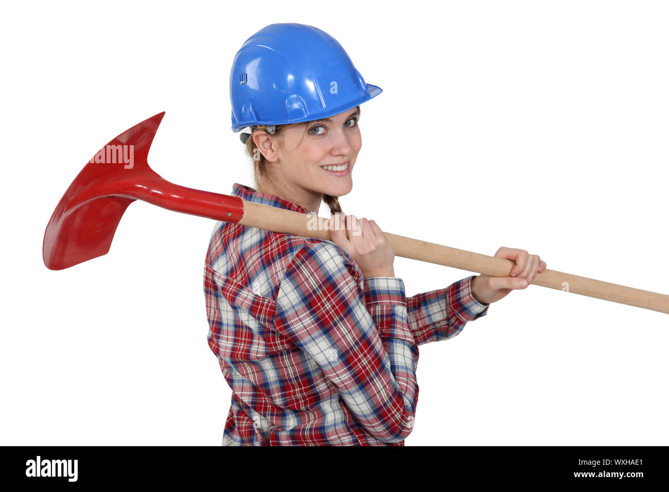 Woman carrying spade Stock Photo - Alamy