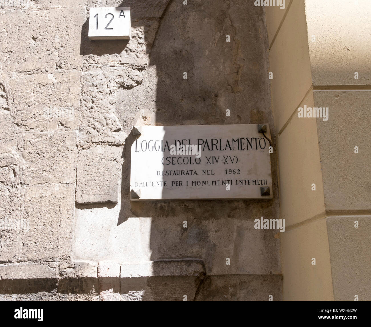 Plaque on the 15th century Loggia del parlamento in Ventimiglia old town, Liguria, Italy, Europe Stock Photo