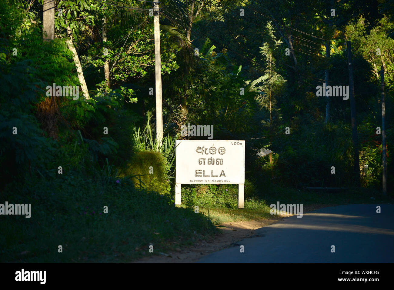 Ella sign at roadside surounded by dense vegetation. Sri Lanka Stock Photo
