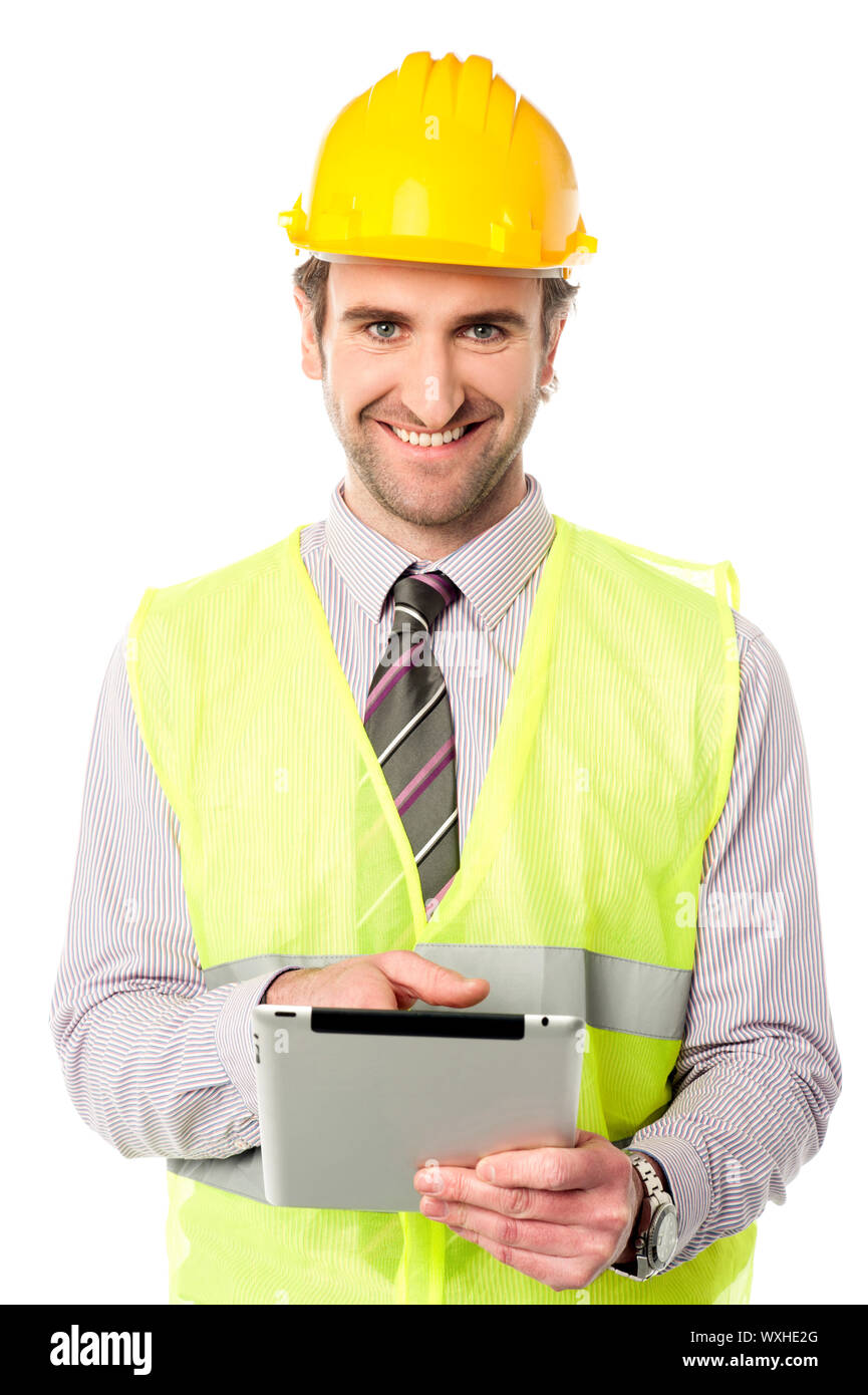 Young mechanical engineer using tablet pc Stock Photo