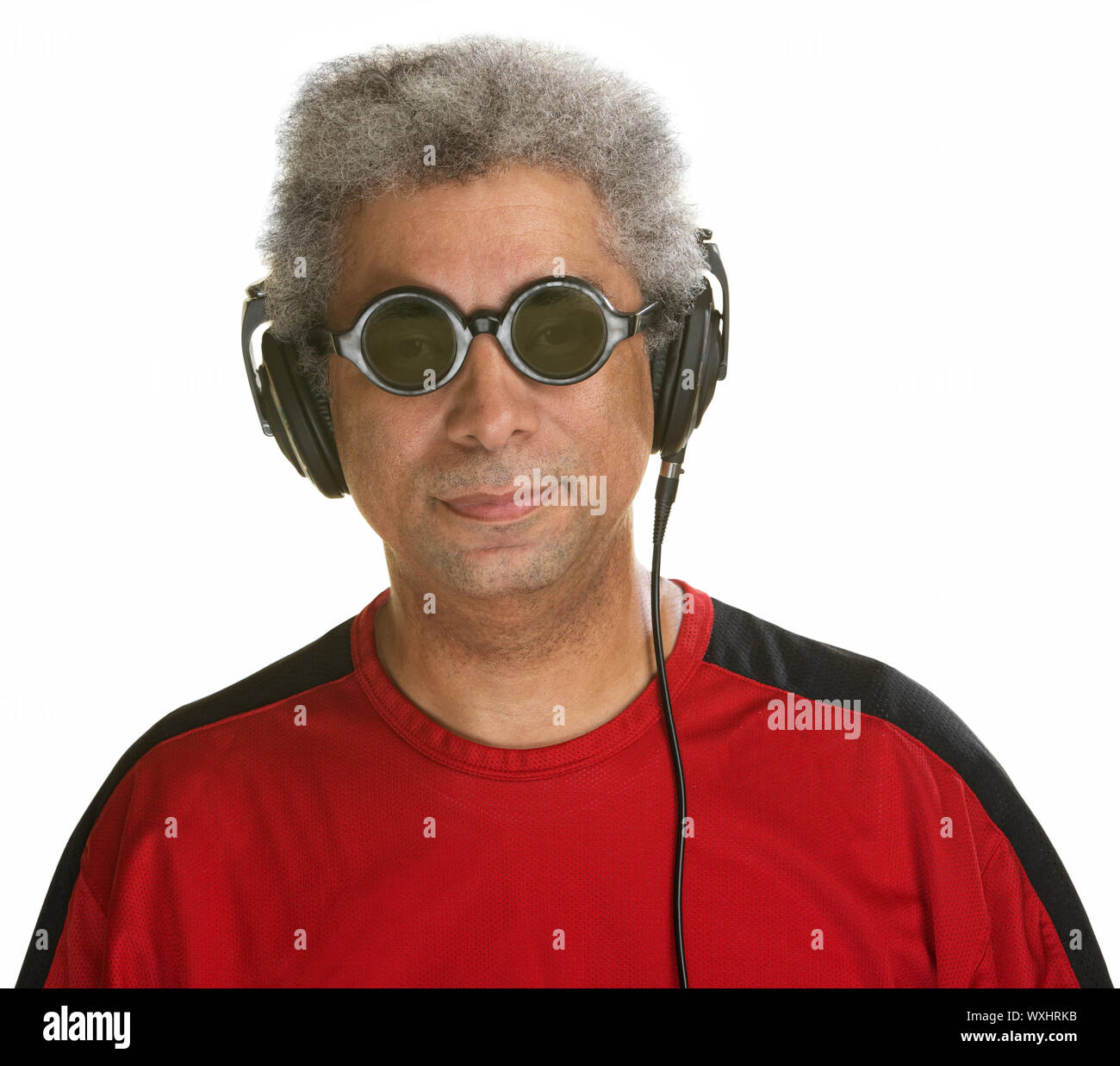 Easygoing Arab man with sunglasses and headphones Stock Photo