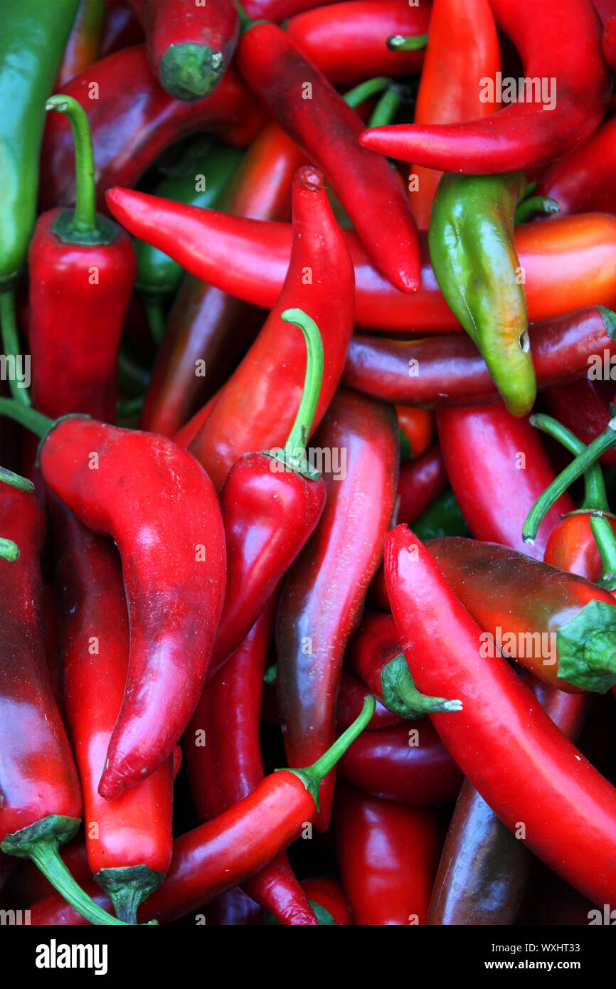 Photo of green and red peppers saling on the market Stock Photo - Alamy