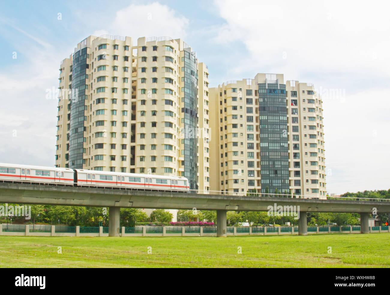 View of Apartments With Nearby Public Transport Subway Train Stock Photo - Alamy