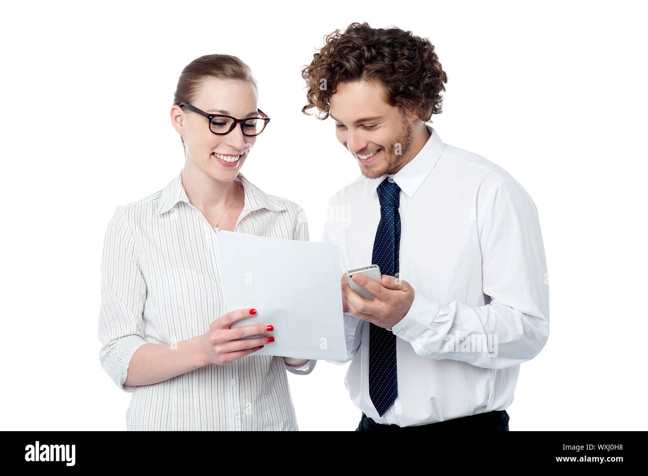 Business executives analyzing annual report Stock Photo